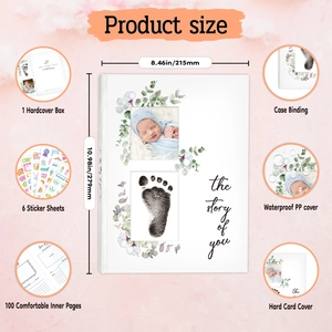 Detail view of baby memory book set with hardcover box, stickers, and 100 pages