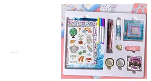 Detail of DIY journal stationery gift set with floral notebook stickers and pens in tray