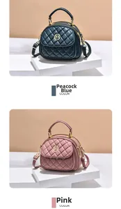 Close-up of quilted chain bags in peacock blue and pink with gold circular logo detail