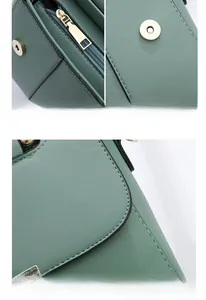 Detail of dark green lychee grain leather handbag with gold metal zipper and fine stitching