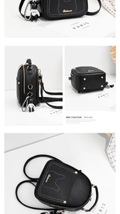 Detail view of black PU leather mini backpack with bear charm and gold rivets