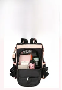 Detailed view of women's black oxford backpack showing spacious interior with multiple pockets