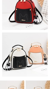 Detail of mini backpack showing crosshatch texture, cat ear stitching and bear charm