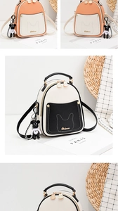 Close-up of stylish mini backpack featuring cat-ear pocket detail and golden logo