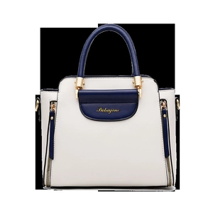 Minimalist ivory and navy contrast color handbag with golden zip accents and handles