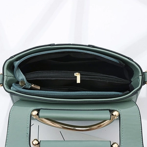 Green leather handbag with gold metal ball handle and multi-layer internal organizer