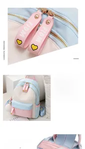 Detail view of colorful oxford fabric backpack with dual zippers and pompom keychain