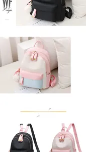 Detail of multi-color nylon backpack with heart zipper and plush ball pendant