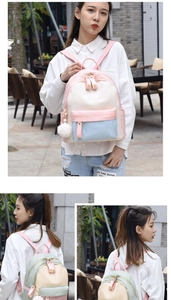 Detailed outdoor view of a multi-color patchwork backpack with heart zippers and plush ball