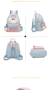 Detailed four-way view showing the blue and pink contrast nylon backpack with pompom