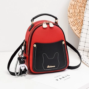 Mini red and black crossbody backpack with bear charm and cat ear design details