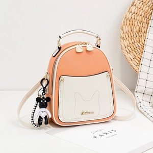 Mini peach and beige leather backpack with bunny ear stitching and bear charm