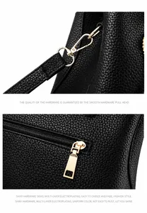 Détail d'un sac en cuir PU noir montrant la texture litchi et les garnitures dorées