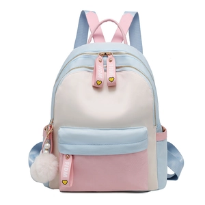 Pastel color block nylon backpack in light blue and pink with cute white pompom charm