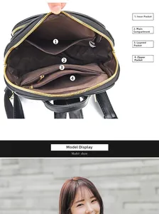Detail view of the black leather backpack's spacious interior with four functional pockets