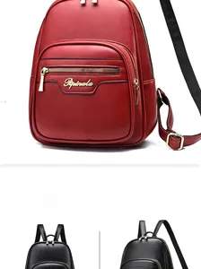 Detail view of leather backpacks with metallic zippers and adjustable shoulder straps