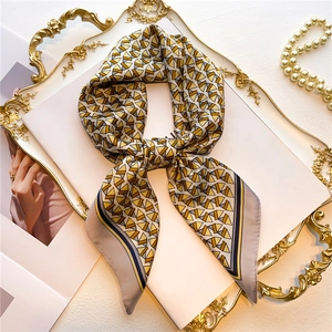 70cm geometric silk square scarf with yellow and grey triangle pattern on gold tray
