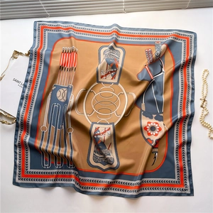 Detail of luxury silk scarf with vintage harness print and elegant fabric texture