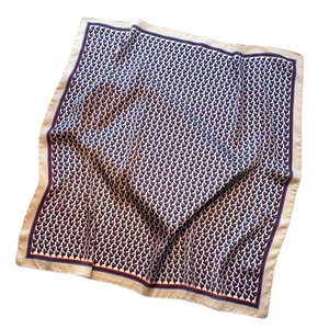 Minimalist geometric square silk scarf with blue and red triangle patterns on beige fabric