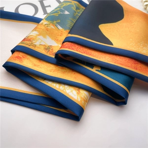 Detailed view of artistic silk scarf with satin texture and elegant hand-rolled edges