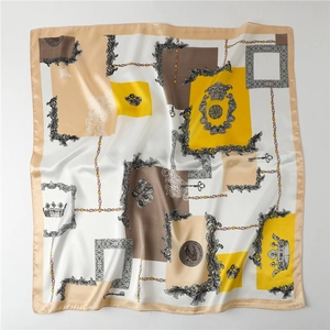 Close-up of silk-satin scarf texture with crown and key vintage pattern print