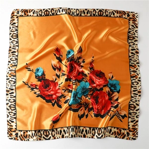 Detailed texture of 90cm satin scarf with leopard print edge and floral rose patterns
