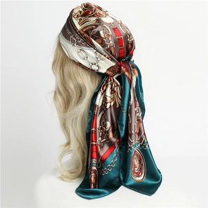 Elegant satin scarf with vintage chain print and horse bit pattern on a mannequin