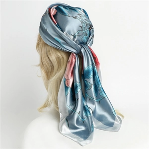 Elegant floral silk headscarf in greyish blue for women, shown in back view style