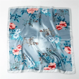 Detail of satin square scarf featuring vintage floral print and blue rose pattern