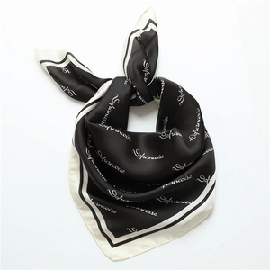 Minimalist black and white silk scarf with elegant letter print and satin gloss finish