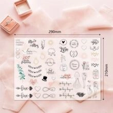 Macro detail of wedding scrapbook stickers with romantic phrases and heart illustrations