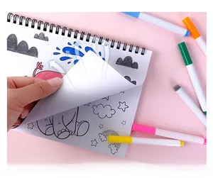 Close-up of thick smooth paper showing cartoon elephant illustration in coloring book