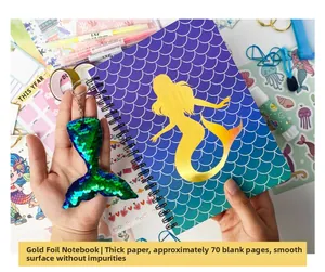 Detail of mermaid spiral notebook with 70 thickened pages and sequin tail keychain