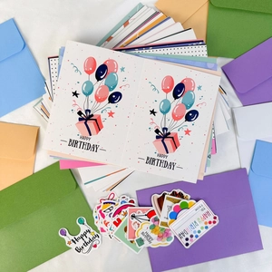 DIY happy birthday greeting card set with colorful envelopes and decorative stickers