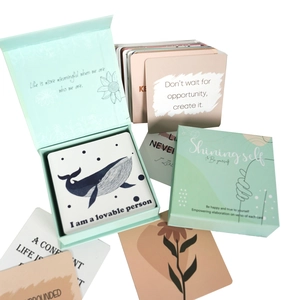 Affirmation card set in green magnetic box featuring motivational quotes and floral art