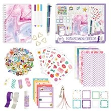 Detailed spread of pink DIY journal set with notebook, stickers, and 100+ stationery items