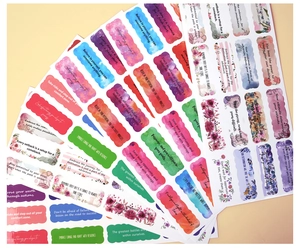 Macro view of colorful watercolor inspirational stickers with scalloped edges and quotes