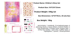 Detailed view of pink DIY journal kit components with precise measurements and stickers