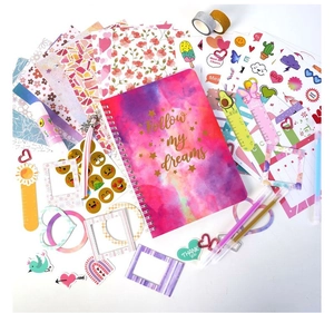 Detailed flat lay of pink DIY journal set with galaxy notebook and craft accessories