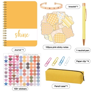 DIY journal stationery set with yellow notebook, love bracelet, and sticker accessories