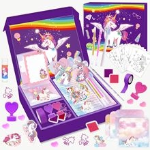 Close-up of unicorn theme DIY stationery kit including purple stickers and stamps