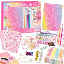 Flat lay of kids DIY journal set featuring glitter notebook, pens, tapes and stickers