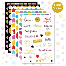 Detail of colorful flash stickers with inspirational English quotes and heart shapes
