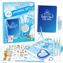 Close-up of DIY blue starry sky journal set with notebook, stickers, and stationery