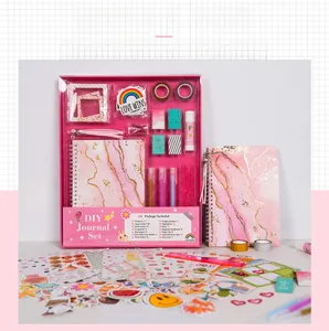 Pink DIY journal set for girls featuring stickers, notebooks and scrapbooking accessories