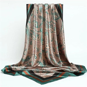 Classic paisley pattern square silk scarf in teal and brown with soft satin finish