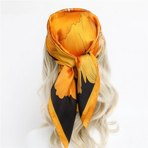Foulard en soie à fleurs orange et noir avec motifs de pivoines en bandeau chic