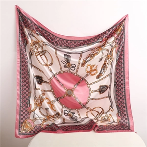 Detail view of 90x90cm satin square scarf with vintage golden chains and equestrian motifs