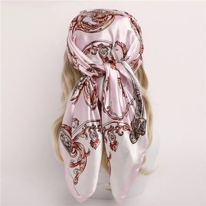 Pale pink satin silk square scarf with baroque pattern tied on a model head back view