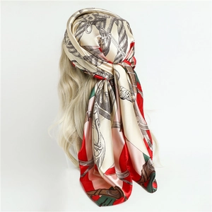 French style silk scarf with retro chain print worn as a headscarf on blonde model